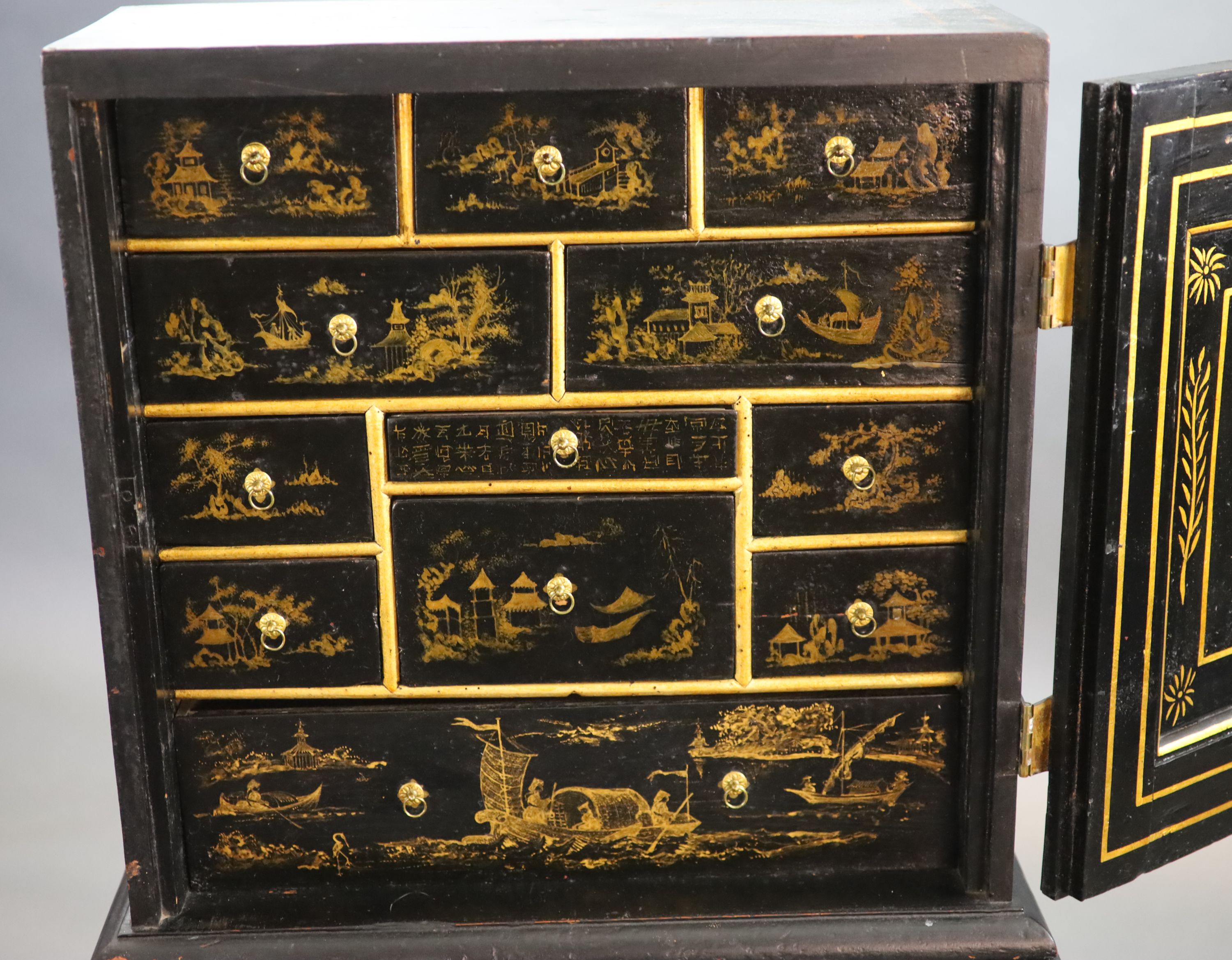 An early 18th century European japanned cabinet on stand, W.54cm D.24cm H.115.5cm